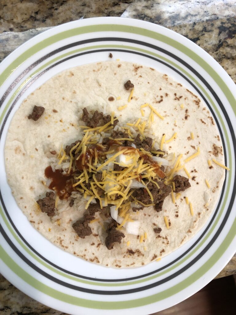 beef taco with cheese and onion